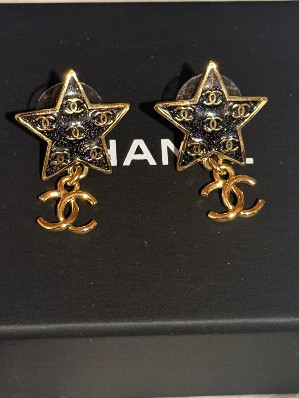 CHANEL Gold Star Drop Earrings with Black Enamel